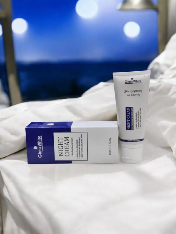 Glut white night cream tube and box on a white surface with blurred background